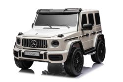 4x4² Voiture électrique pour enfants 12V 2 places Mercedes-Benz G63 AMG, blanc, Lecteur MP3 avec entrée USB/AUX, Conduite 4x4, Batterie 12V14Ah, Roues EVA avec suspension, Sièges en similicuir, Télécommande, Licence